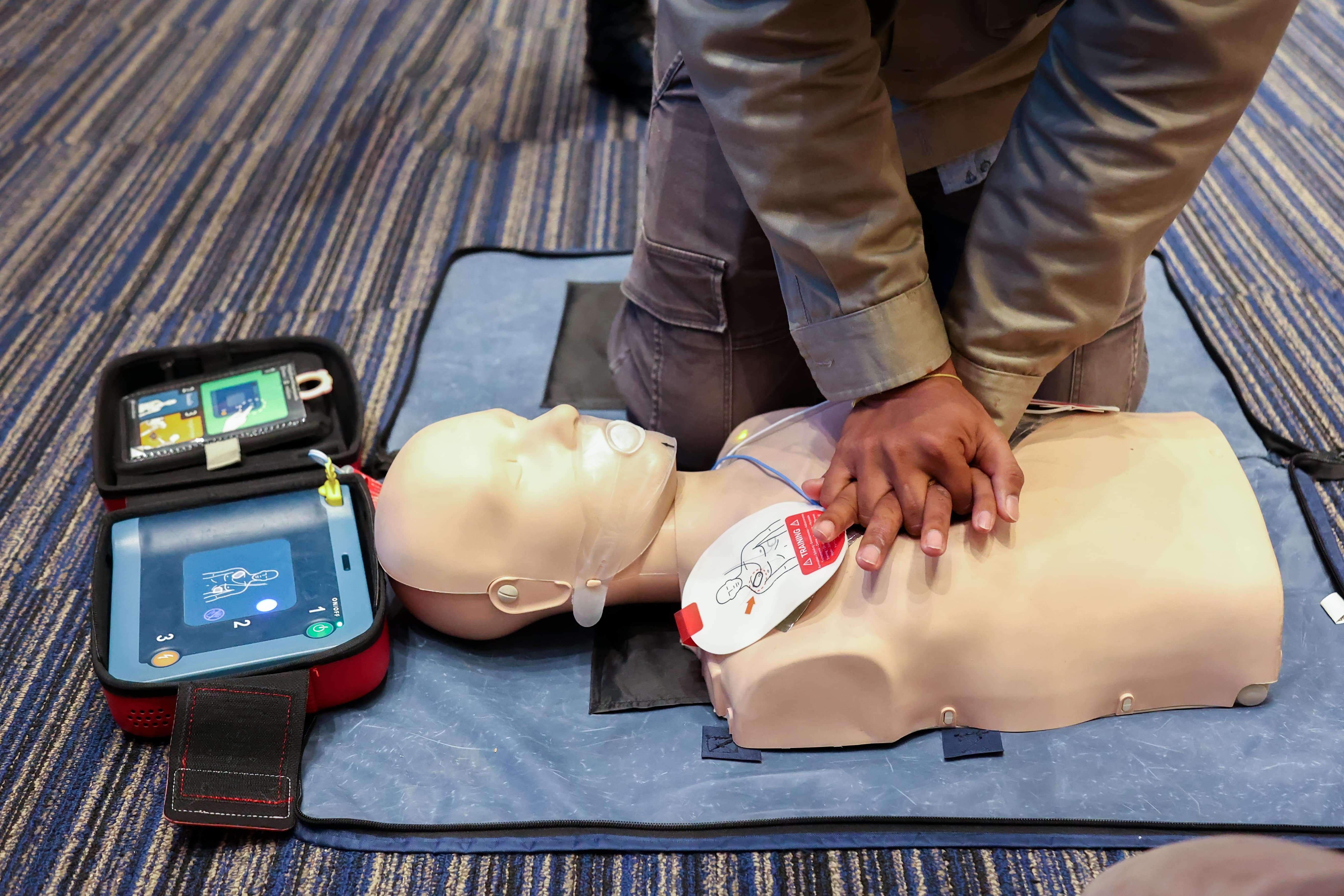 Standard First Aid Recertification training session with instructor reviewing CPR techniques